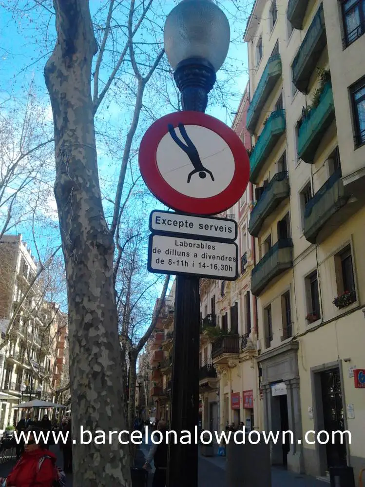 Swinging Man - Graffitied roadsign Barcelona