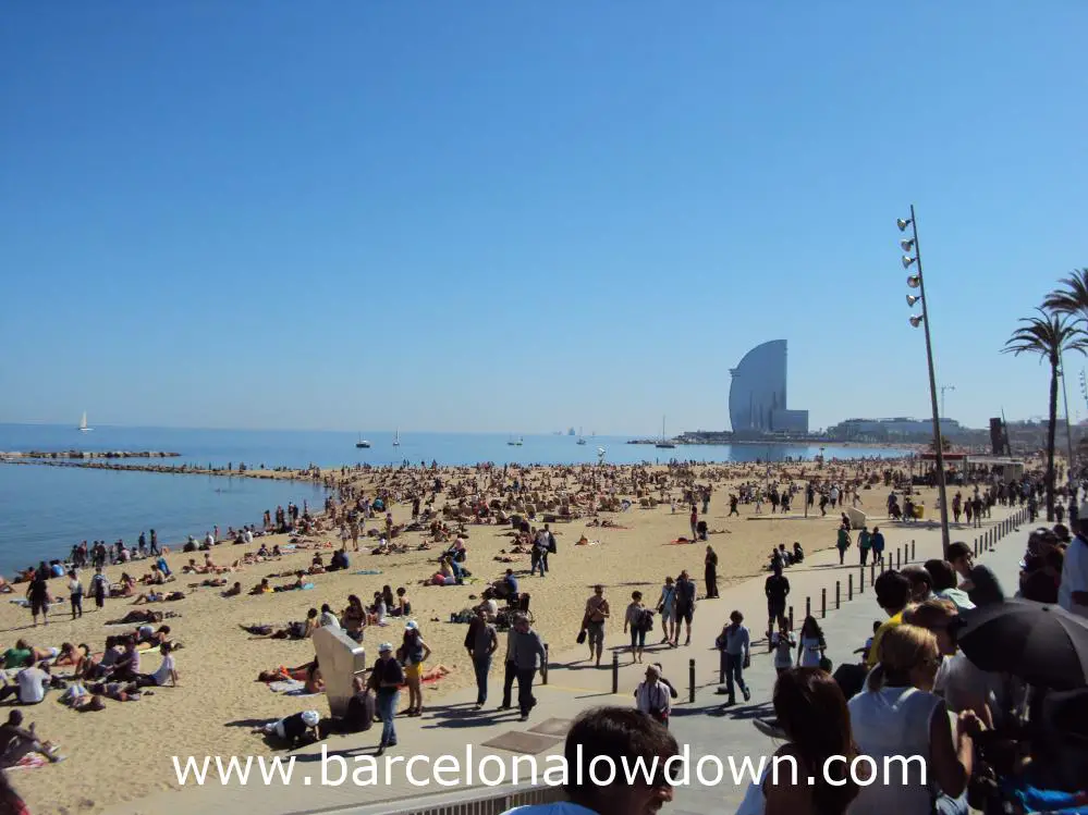 Locals and tourists enjoying the spring sunshine on the Barcelonata beach.