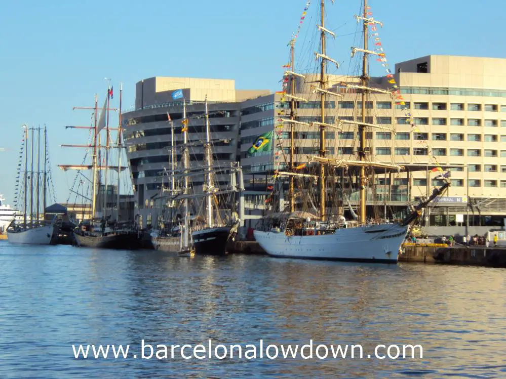 4 tall ships moored up in a row in Barcelonas old harbour (Port Vell)