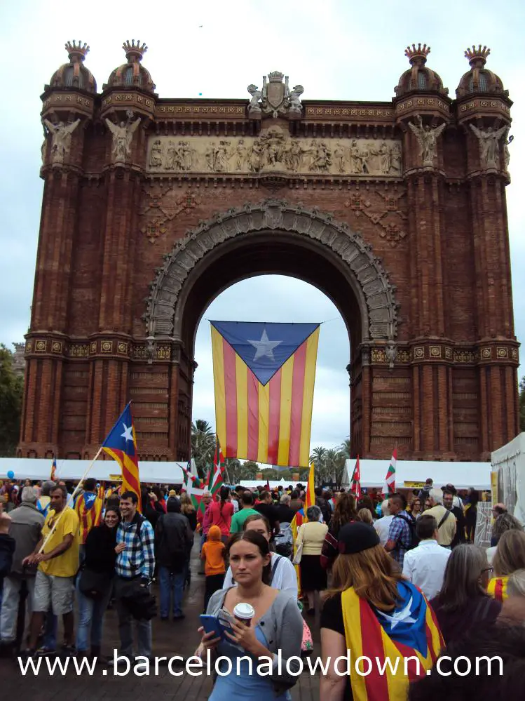 A giant Catalan independence flag flying at the Arc de Triomf Barcelona