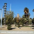 Willows, palm-trees and architecture in a park in Barcelona