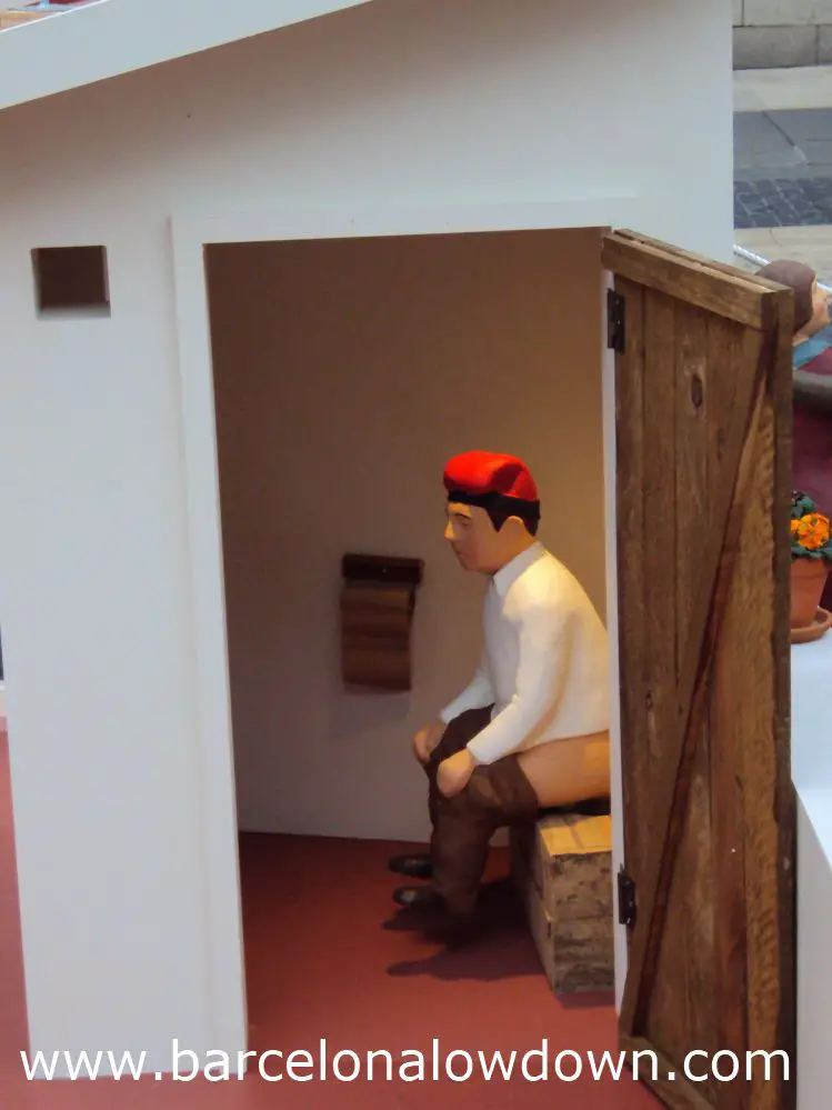The Caganer sits on a rooftop toilet in the nativity scene in Plaça Sant Jaume