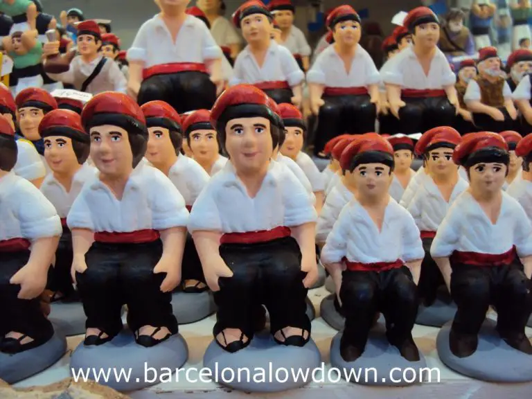 Rows of caganers for sale at a Christmas market