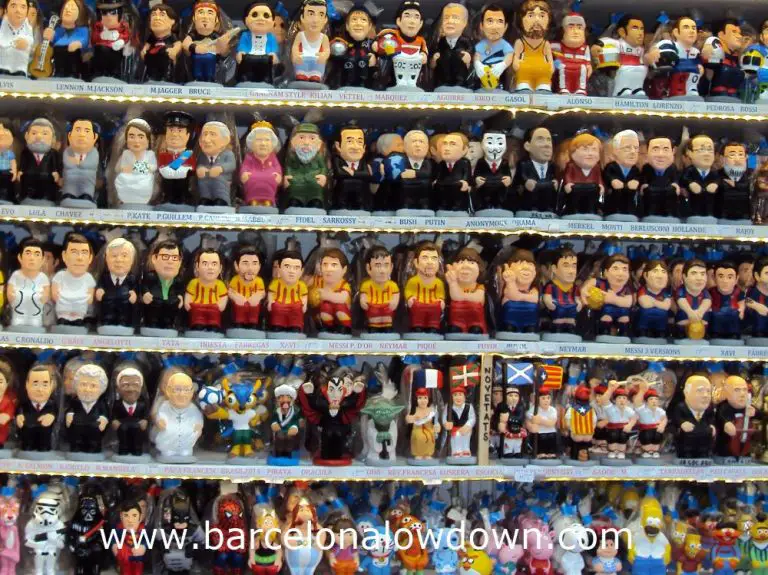 Lots of colourful Caganers for sale on a stall at one of the Christmas Markets in Barcelona