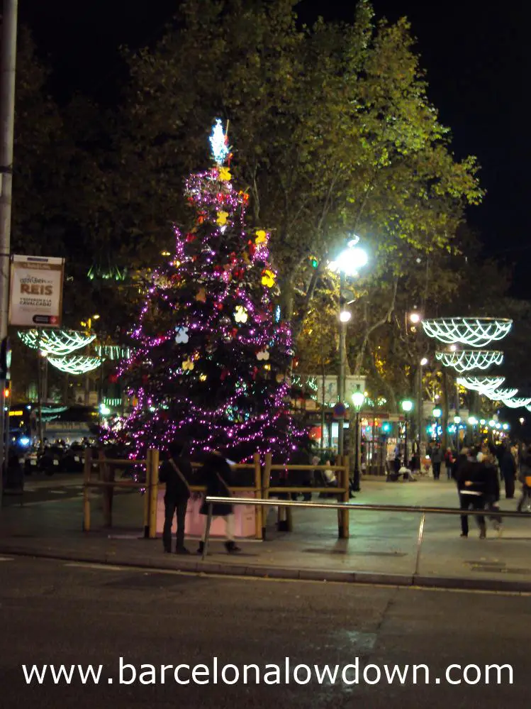 Christmas tree and lights on the shopping street Passeig de Gracia, Barcelona