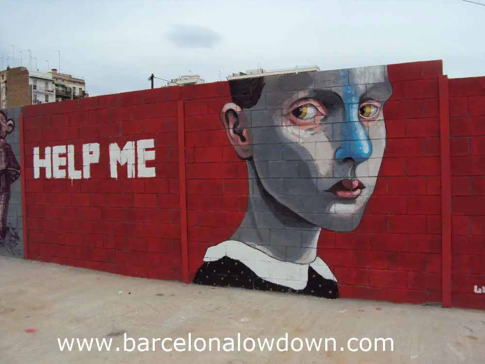 Urban art painted on a wall showing a serious looking girl on ared background with the words help me painted in white capitals.