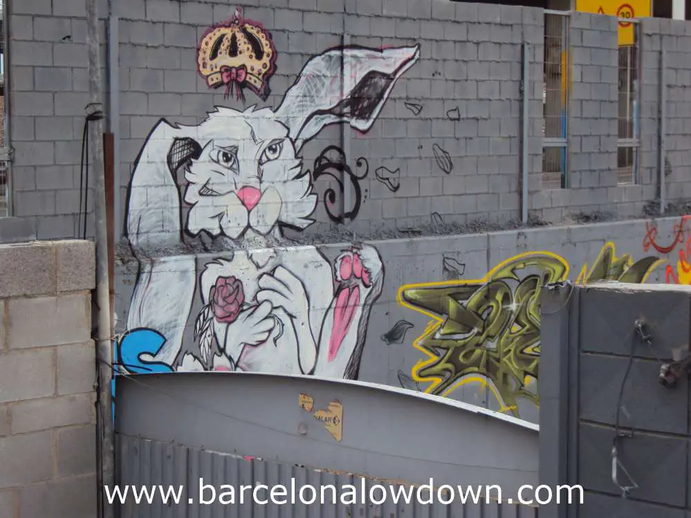 Crazy looking rabbit graffiti and various tags.