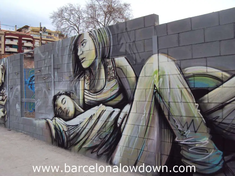 Painting of a young couple painted on a wall in Barcelona, part of the firsta us barcelona street art event