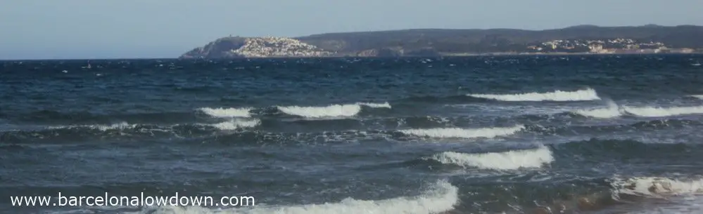 Small waves lapping the beach at Sant Pere Pescador near Barcelona Spain