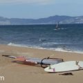 Windsurfer on the long sandy beach at Sant Pere Pescador, Spain