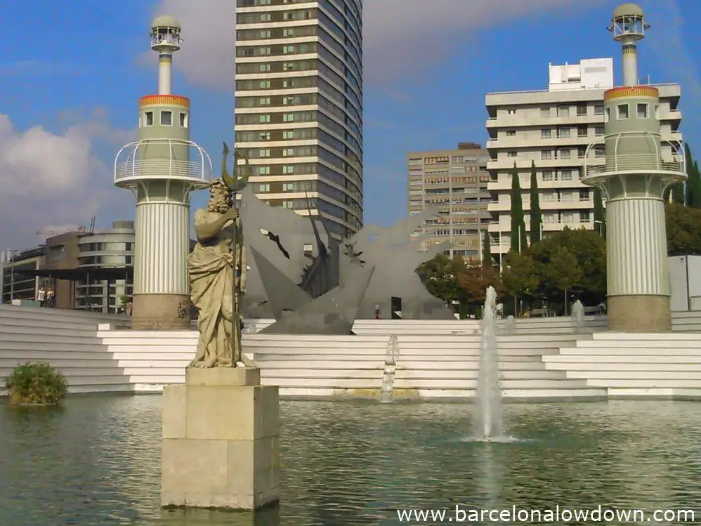 Statue of neptune in the middle of the green lake in the Parc de l'Espanya Industrial Barcelona