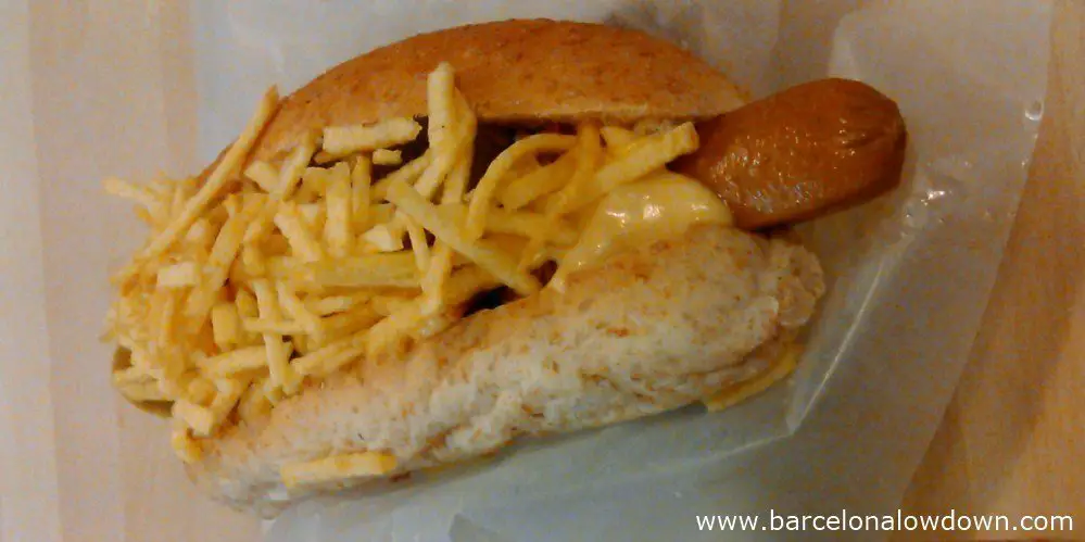 A delicious vegetarian hotdog in a wholeweat bun on the counter of The Dog Is Hot restaurant in Barcelona's Raval neighbourhood.