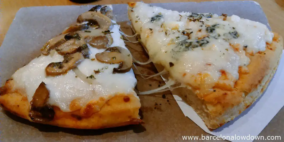 2 slices of freshly baked pizza at the Pizzeria del Born, Barcelona