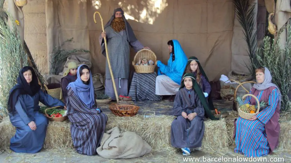 Bored looking actors in a living nativity scene in Poble Espanyol, Barcelona