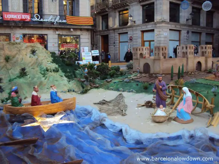 The three kings arriving at Barceino by boat in the giant nativity scene in Barcelona's Saint James' square.
