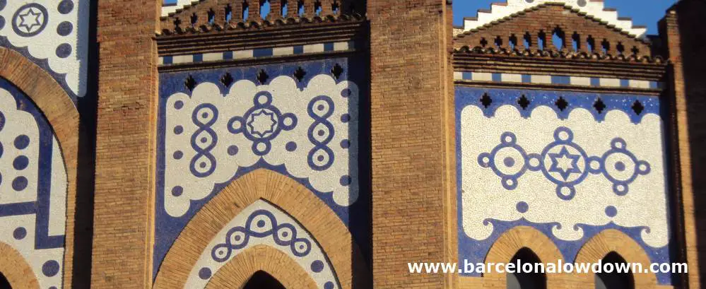 Blue and white tiles which form geometric designs on the outside walls of the plaça de toros monumental bullring in Barcelona