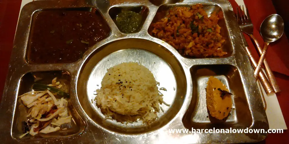 Stainless steel Thali plate in Veg World India vegetarian restaurant in Barcelona