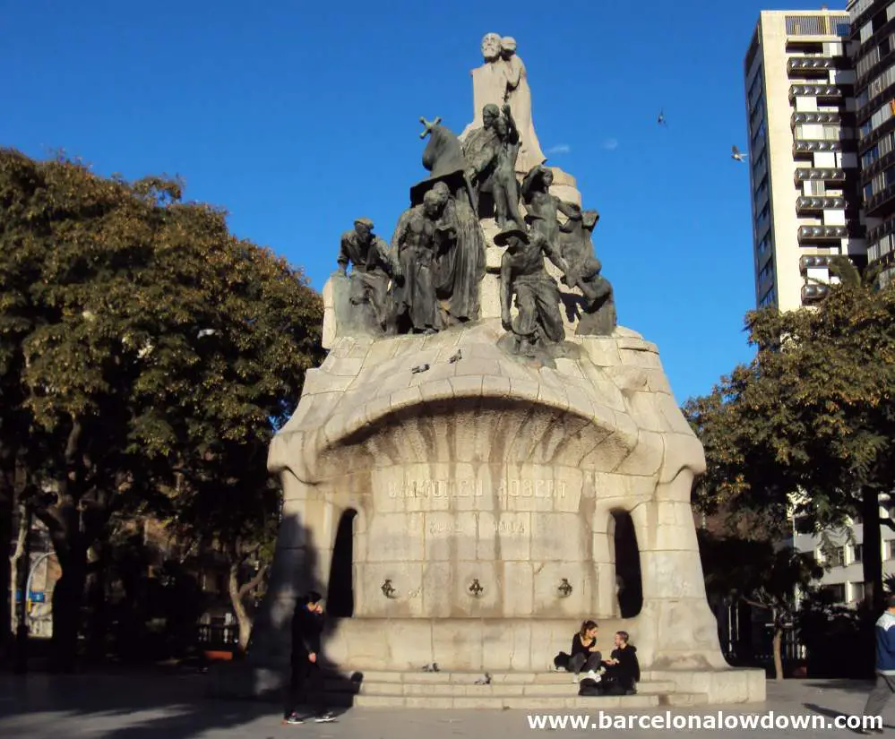 Monument to Dr Robert surrounded by trees in Plaça de Tetuan Barcelona