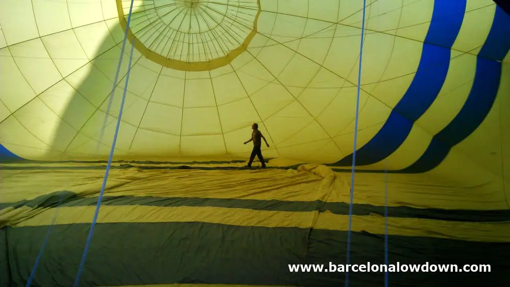 The pilot of our balloon carefully checking that everything was OK shortly before take off near Barcelona