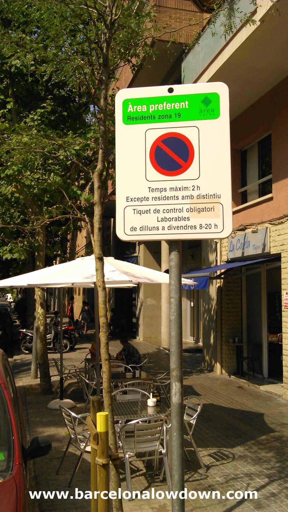 Resident parking sign in the Poblenou neighbourhood of Barcelona. This area allows free parking in August.