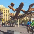 The Gambrinus giant smiling crayfish statue and the pop art style Barcelona's Head at Barcelona's Port Vell old harbour
