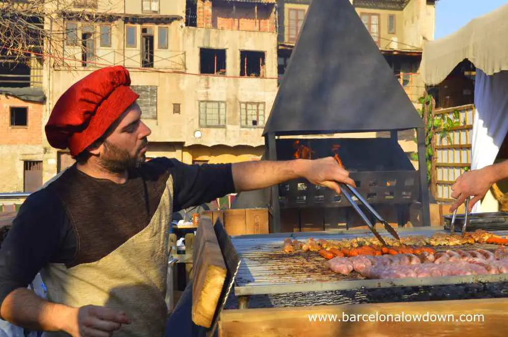 Medieval chef preparing butifarras