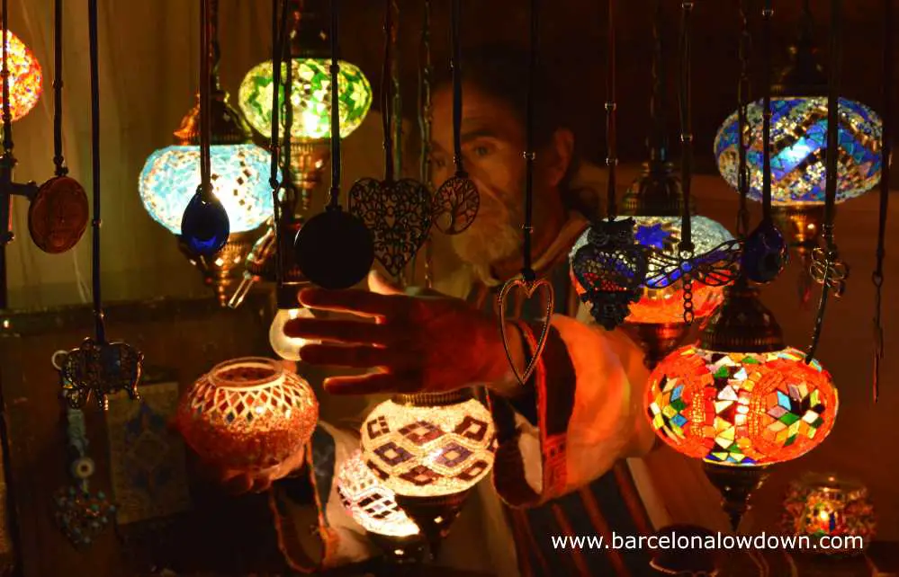 Turkish coloured glass lamps for sale at the medieval market of Vic