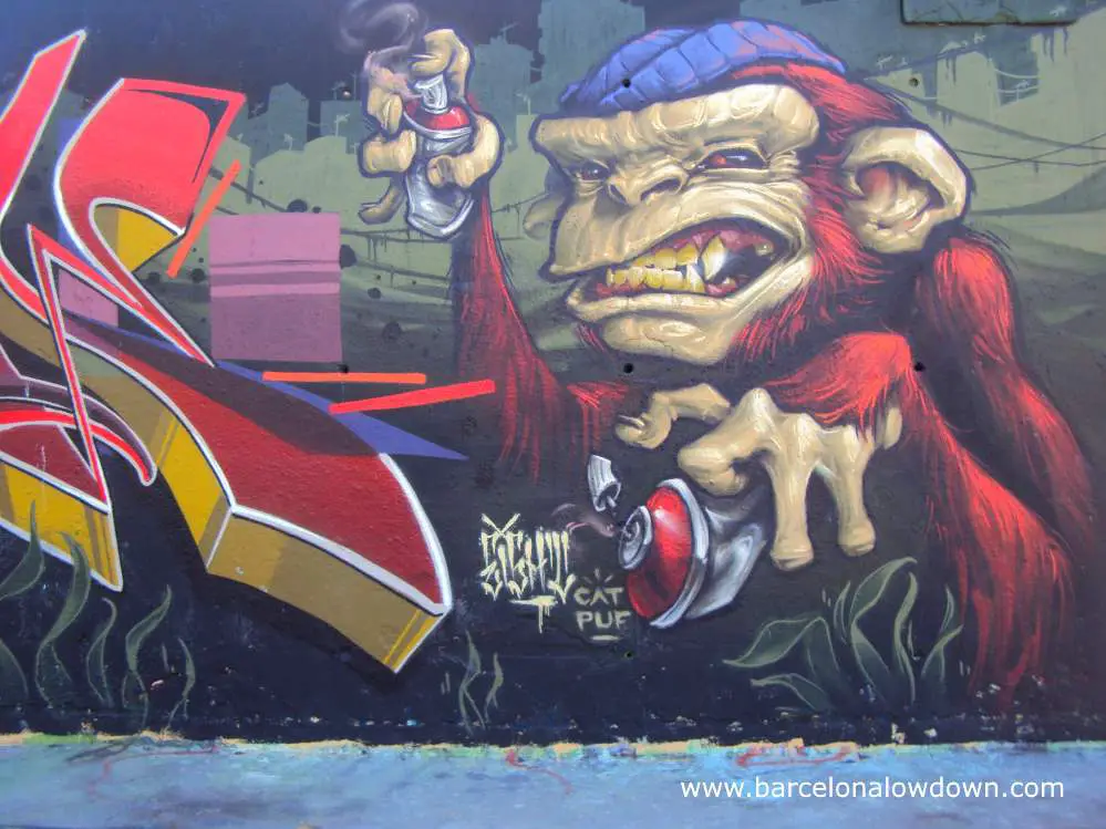 Monkey graffiti artist painted on one of Barcelona's first legal graffiti walls in the Parc de les 3 xemeneies
