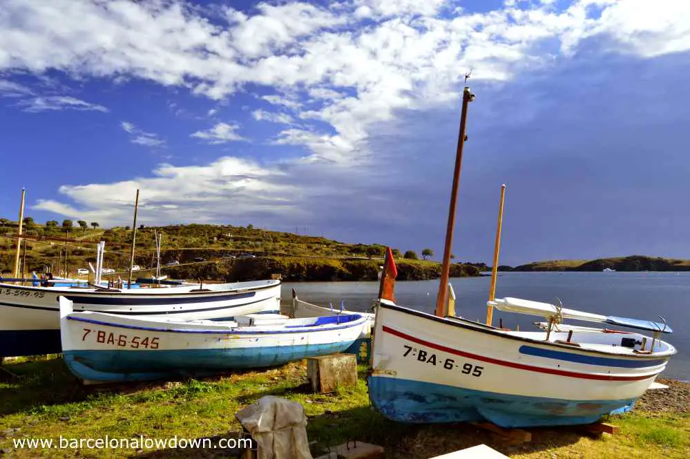 Traditional fishing boats dragged up onto land in the cove of Prtligat near Cadaqués on the Spanish Costa Brava