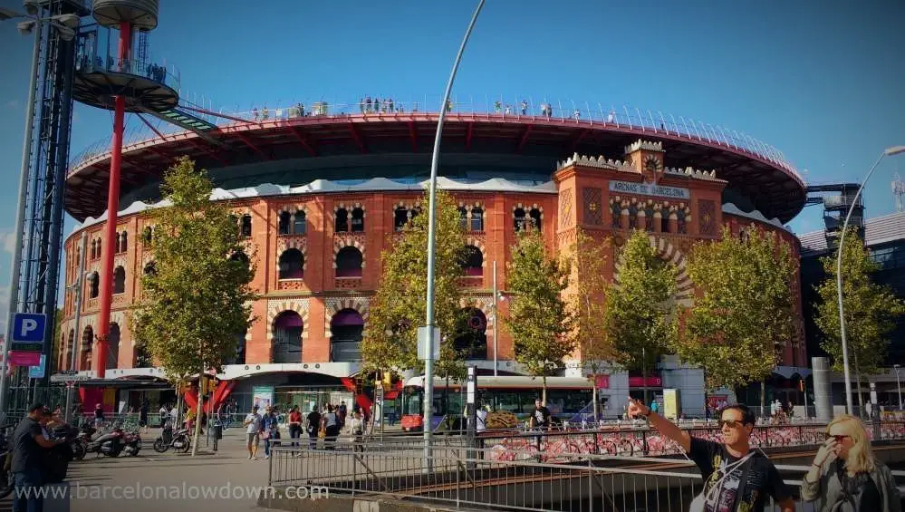 Tourists line the viewing platform of the Las Arenas bullring turned shopping mall in Barcelona