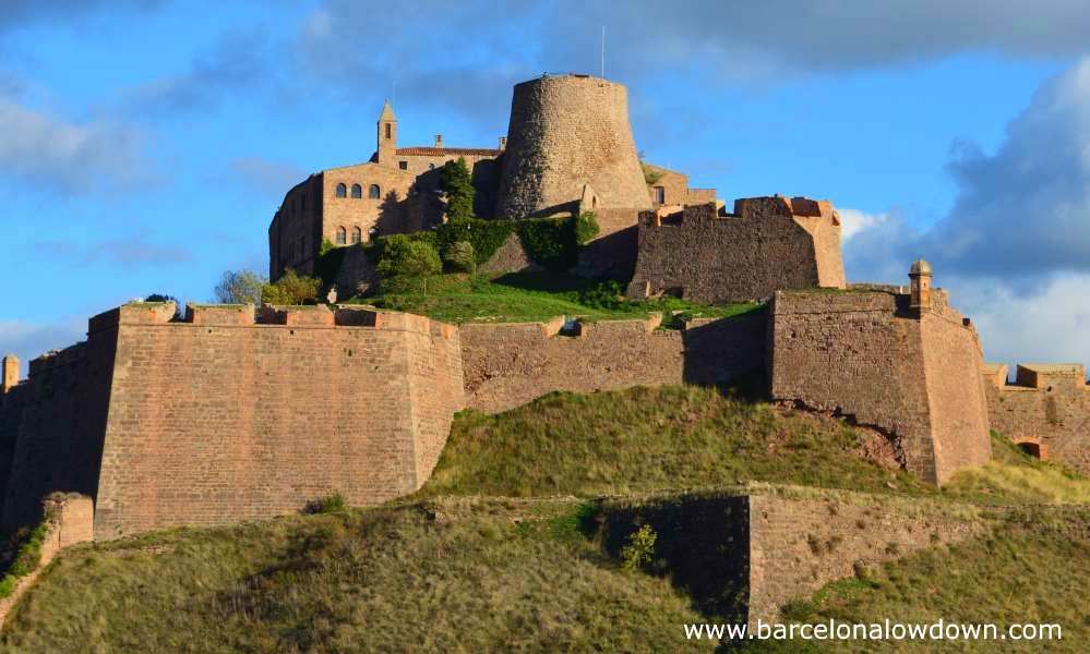 Photo of Cardona castle taken at the viewpoint in Cardona old town. The photo shows a clear view of the bastions which date back to the 17th century and the medieval Minyona tower which was built in the 9th century by Wilfred the Hairy of Barcelona.