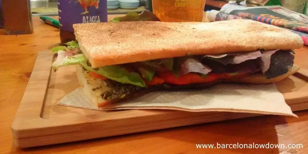 A so called escalivado vegan sandwich served on coca bread at the Quinoa bar in Barcelona's trendy Gracia neighbourhood