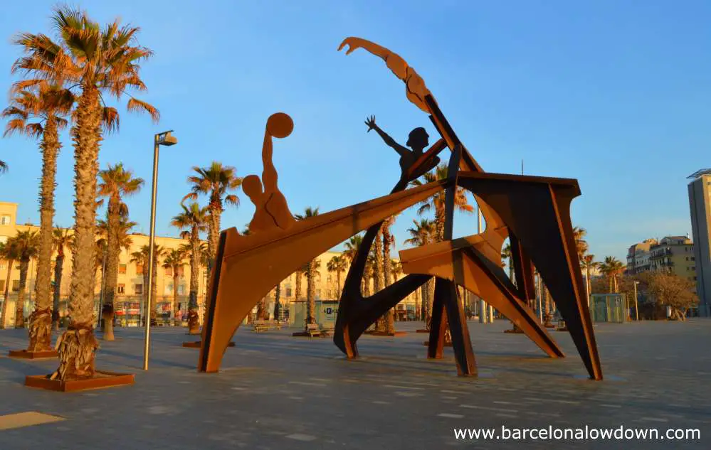 The homage to swimming monument on the Barceloneta beach in Barcelona early in the morning when nobody is about
