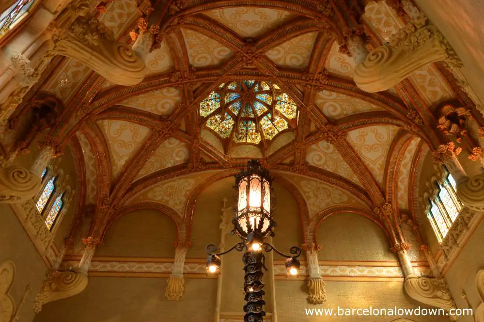The highly decorative ceiling with glass dome above the staircase of the administration building of the Sant Pau Art Nouveau site in Barcelona