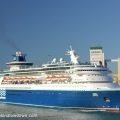 A blue Pullmantour cruise liner docking at the Moll Adossat wharf Barcelona