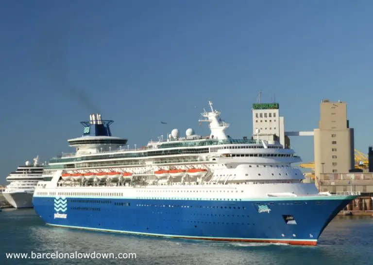 A blue Pullmantour cruise liner docking at the Moll Adossat wharf Barcelona