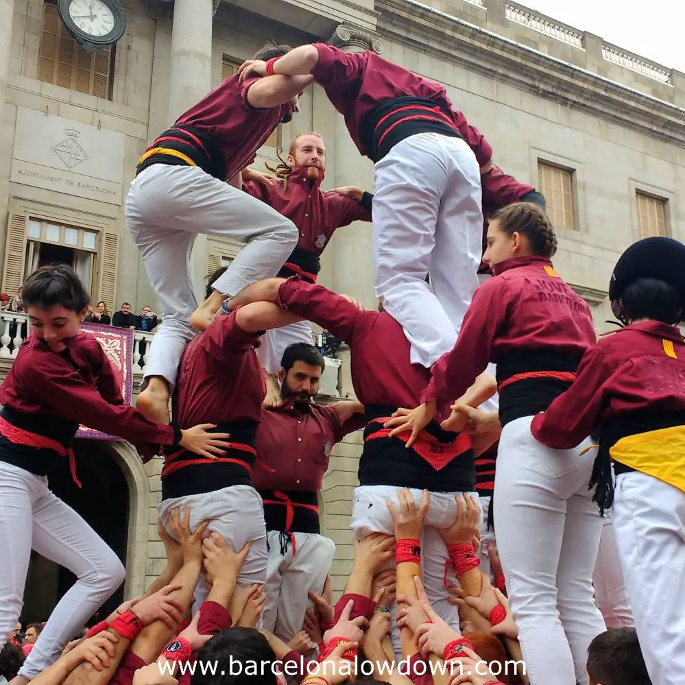 A team building a human tower during a local festival in Barcelona