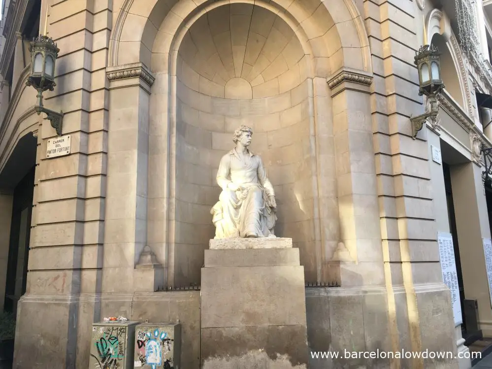 The white marble statue of Pintor Marià Fortuny which stands on the street which bers the artists name in Barcelona's el Raval neighbourhood.