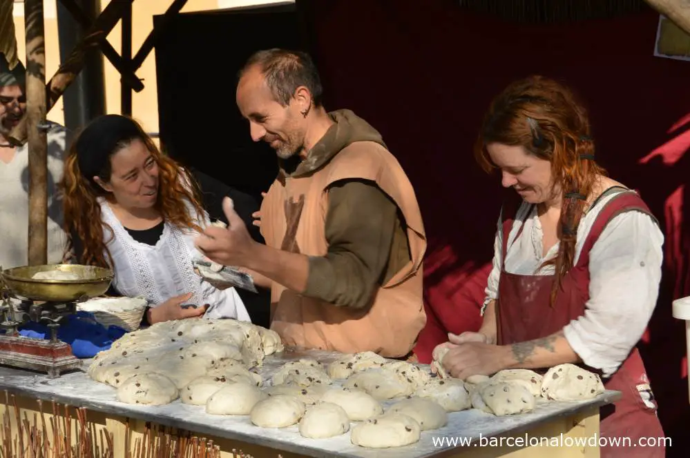 Bakers making bread during Manresa medieval fair la Fira de l'Aixada