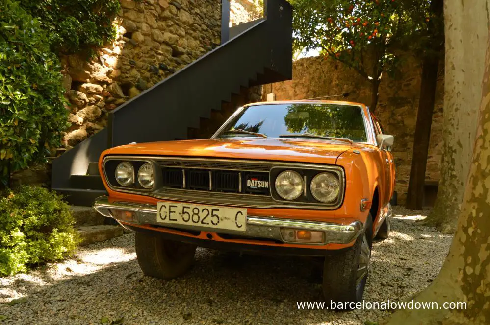 Salvador Dali's orange Datsun 610 in the garden of Pubol castle