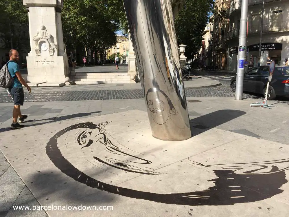 Dail reflected in a metal tube, statue in La Rambla, Figueres, Catalonia
