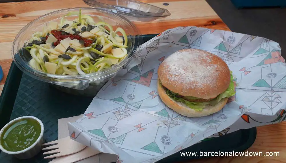 Vegan burger with avocado and salad served on a tray, fst food style at the Trocadero restaurant near the Sagrada Familia, Barcelona