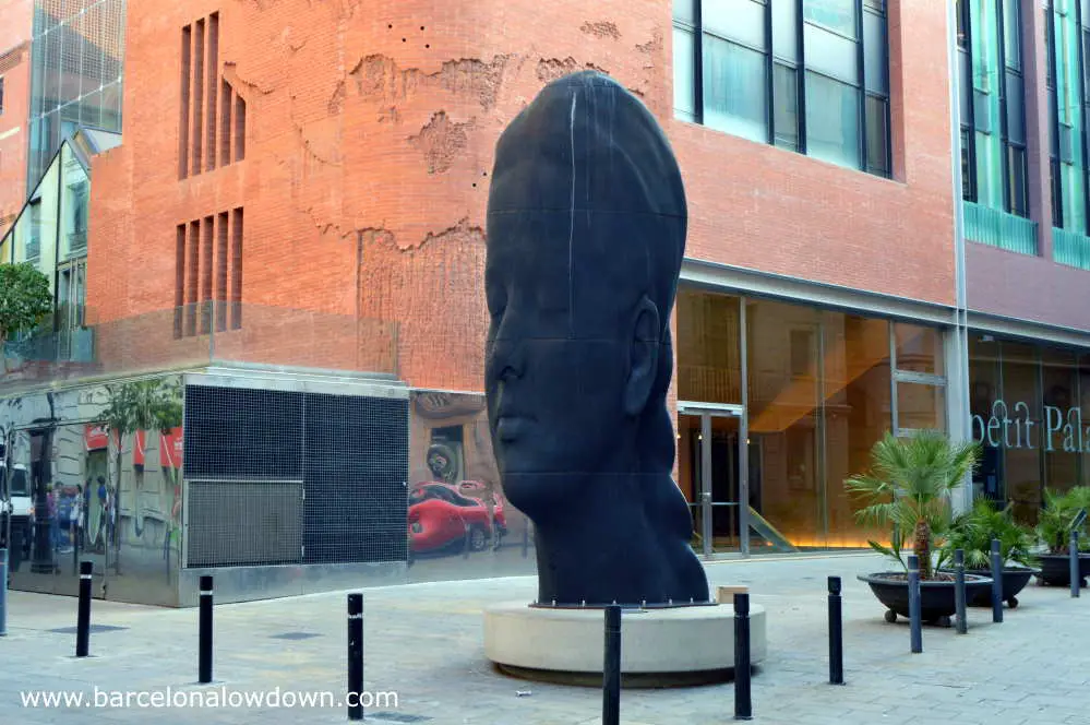 Carmela, the 2D statue of a young girl's head in front of the Catalan Music Palace in Barcelona's Gothic Quarter