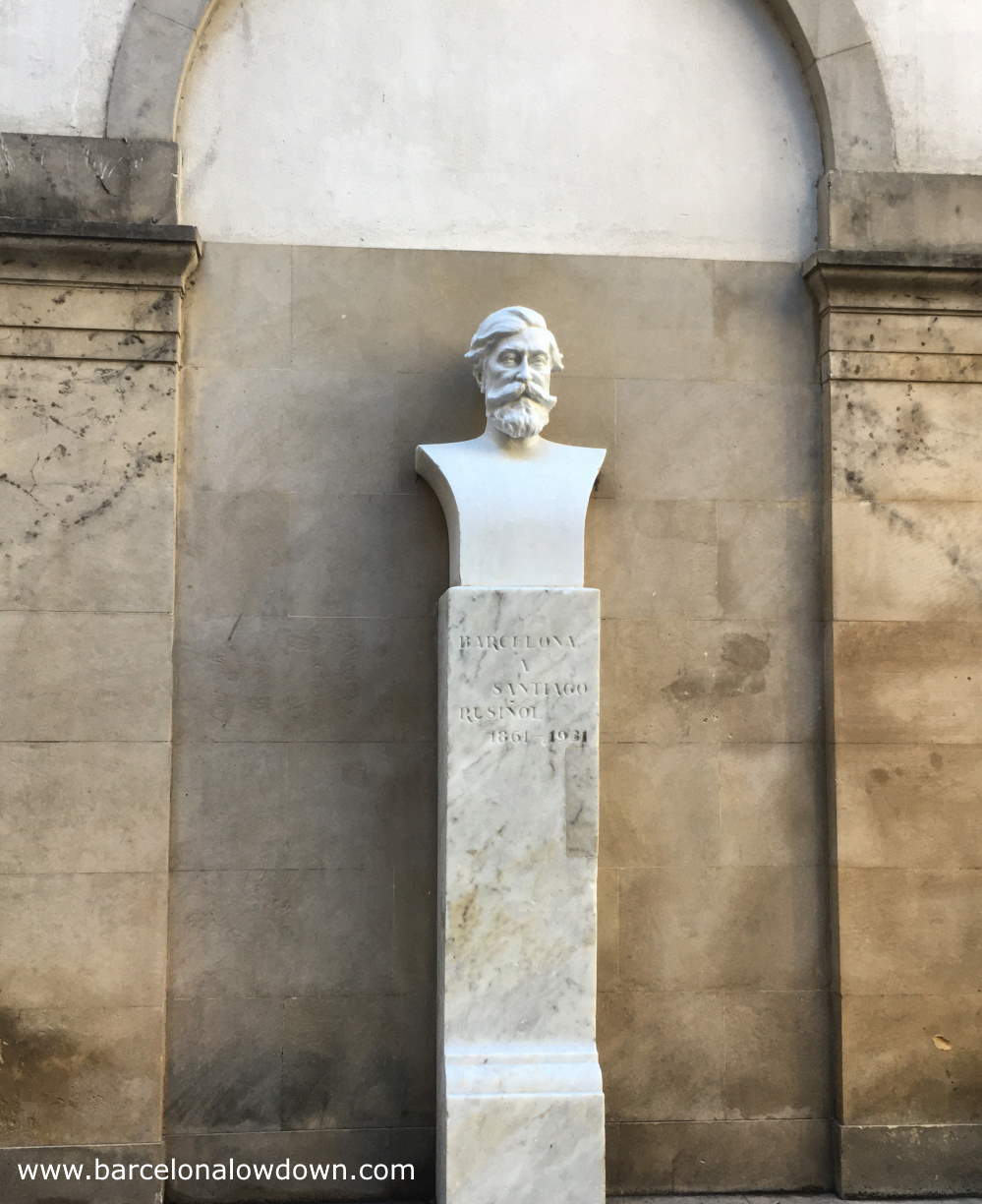 White bust of Catalan artist Santiago Rusiñol on a tall white marble plinth