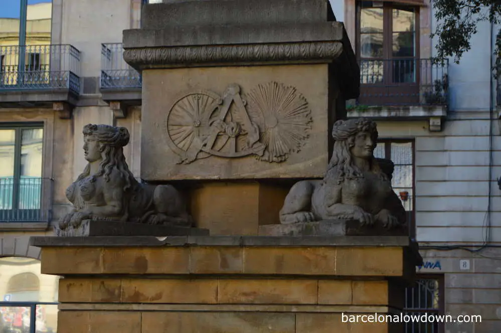 Sphinxes and masonic symbols on the base of Neptune's fountain, Barcelona, Spain