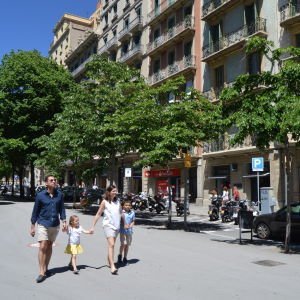 A family walking in the Eixample district of Barcelona