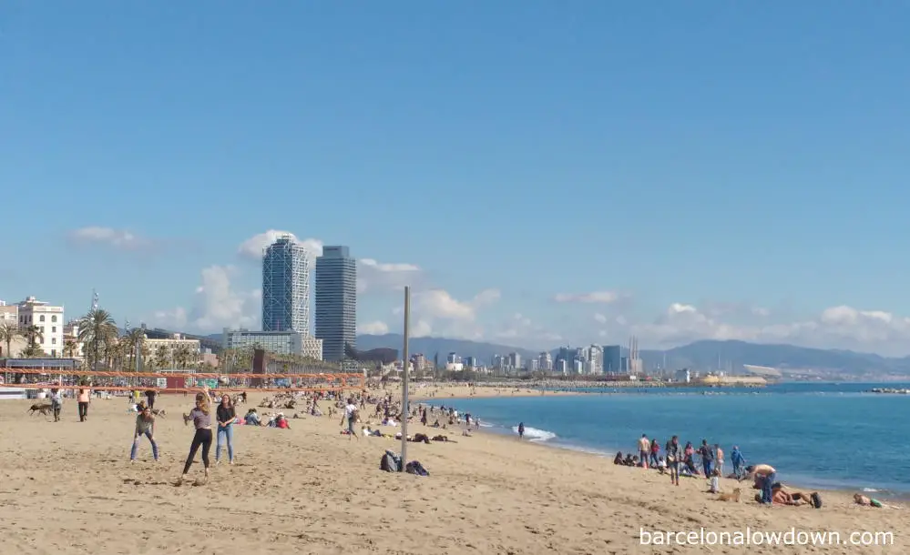 People relaxing on the beach in the Barceloneta neighbourhood of Barcelona