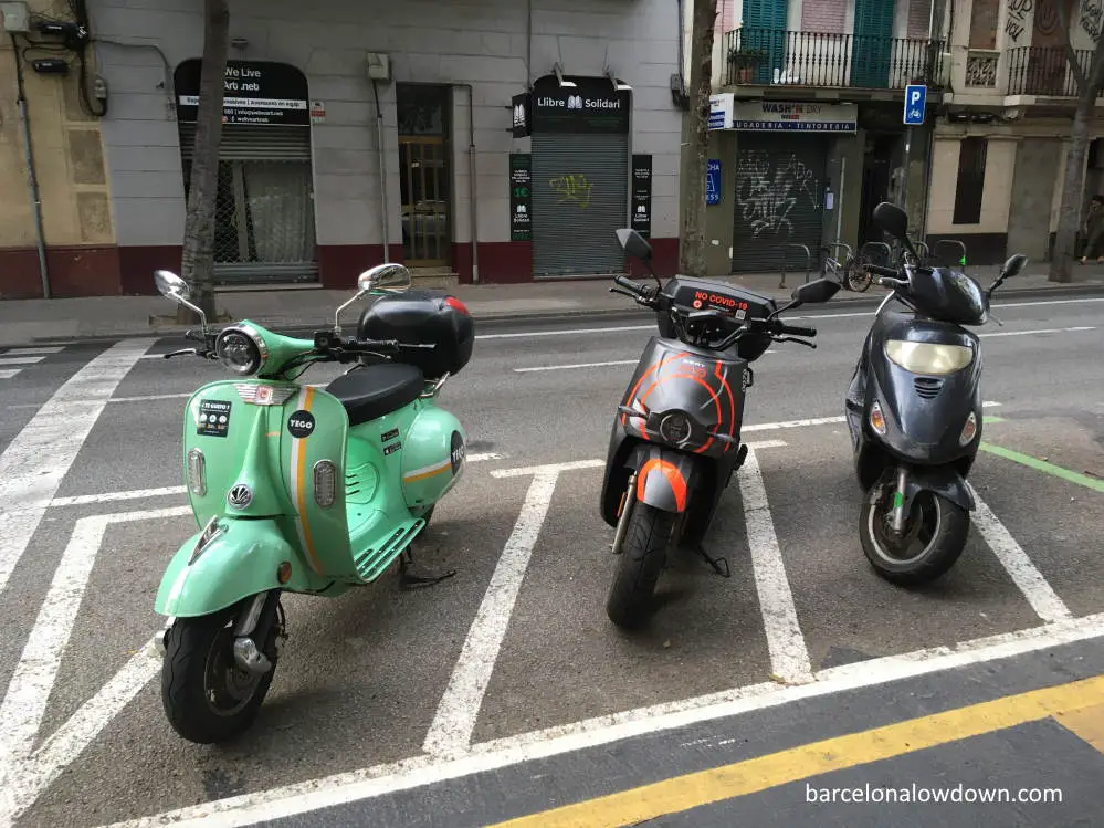 Electric scooters parked on the road in Barcelona, Spain