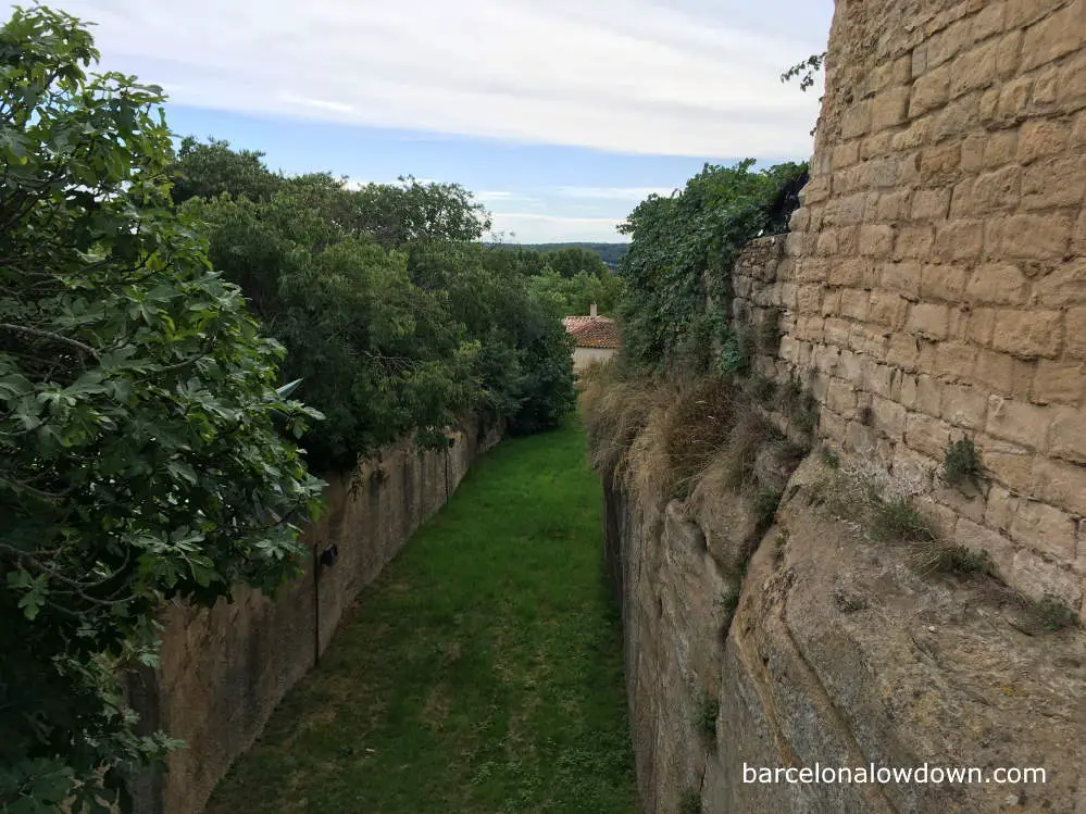 Defensive stone walls and a moat outside Peratallada, Costa Brava, Spain