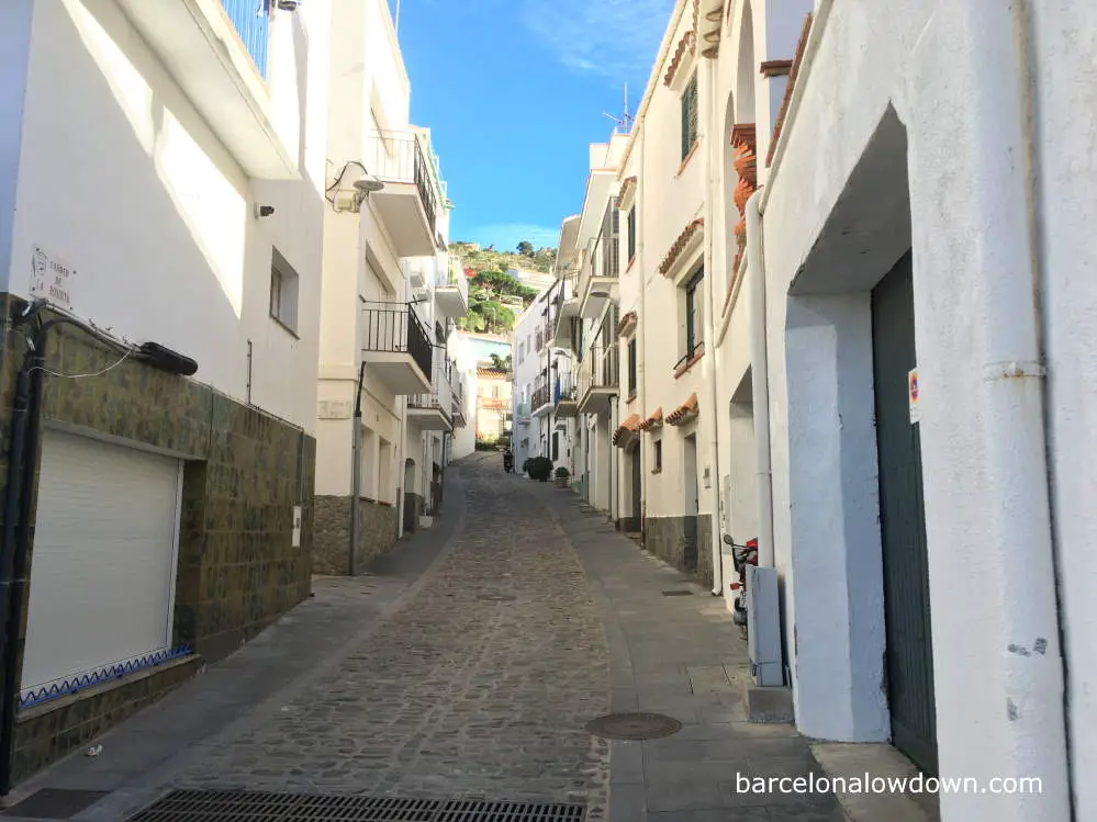 Typical cobbled streets and whitewashed houses in El Port de la Selva, Spain